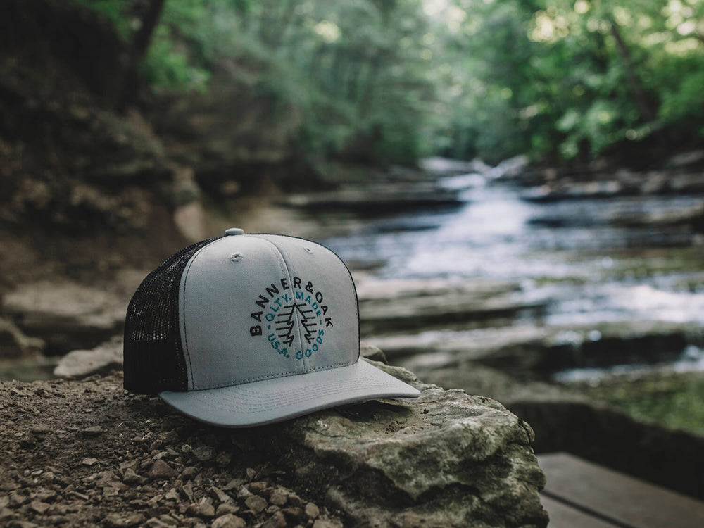 Evergreen Embroidered Snapback Trucker Hat Gray Lifestyle Image